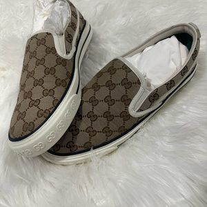 Gucci supreme slip ons